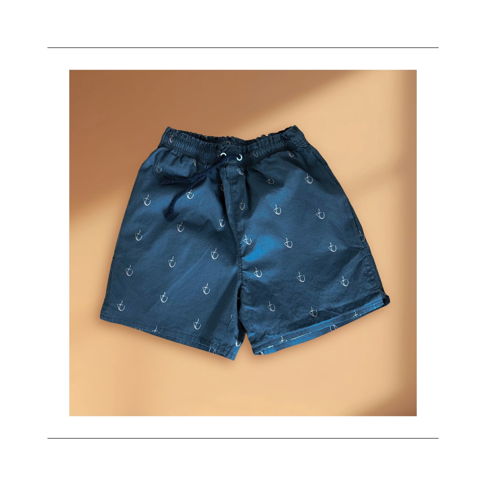 Boy and men mid thigh short front view sewing pattern with side pockets, leg slits for movement, elastic and cord tie waist
